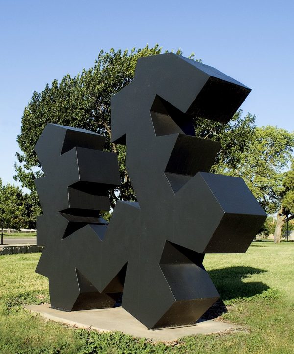 Abstraction of geometric shapes in black. Two sides are flat and between the flat sides are a great variety of angles. The surface has a slight texture.