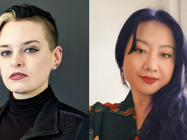 Photo of two women, one with short hair that is blonde and black, and the other with long hair that is tinted purple