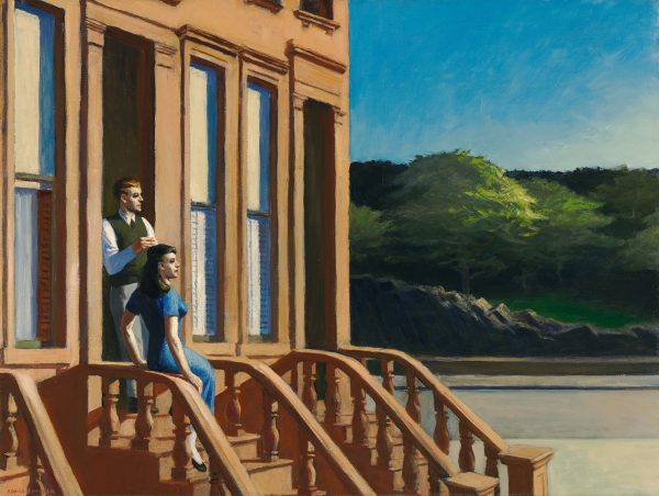 A couple look into the distance from their brownstone staircase.