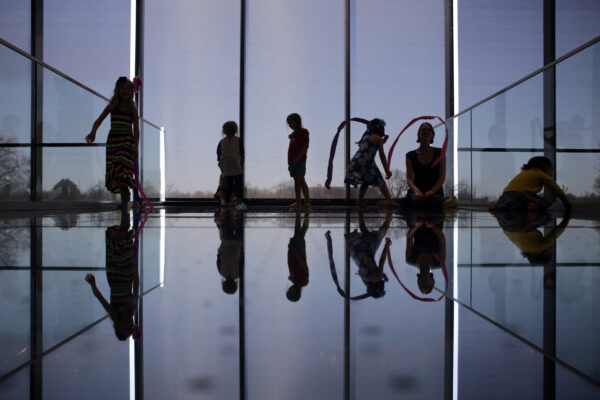 Silhouette of children dancing